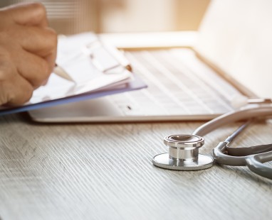 Medical stethoscope on documents