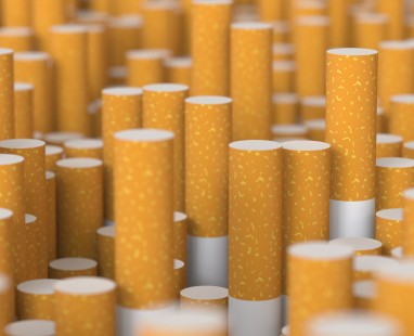 Multiple cigarette filters arranged showing tobacco waste and health risks